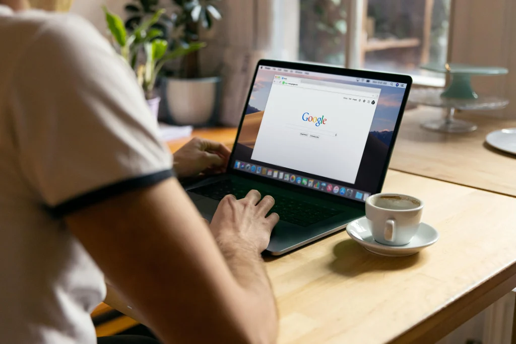 A man using laptop searching Google